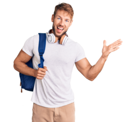 Young caucasian man wearing student backpack and headphones celebrating victory with happy smile and winner expression with raised hands