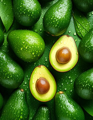 Creative food concept. Fresh avocados avocado green adorned with glistening water droplets...