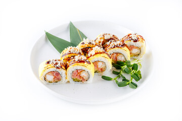 Sushi rolls with shrimp, cucumber, eel and tuna served with soy sauce