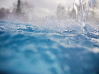 Obraz premium A body of water with a splash of water in the foreground. stockphoto.