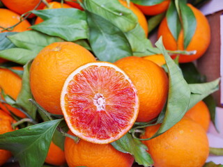 A bunch of oranges with one cut open. stockphoto.