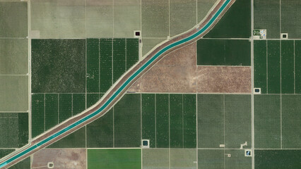 irrigation canal and fields Irrigation canal that divides the fields into two looking down aerial...