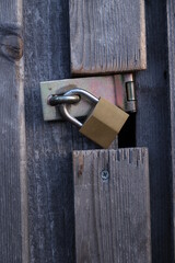 A wooden door with a lock on it