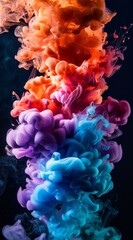 Obraz premium Colorful ink in water creating vibrant abstract design on a black background