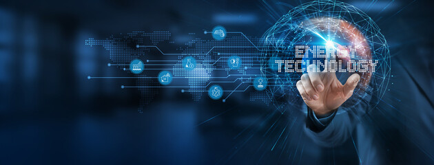 Leveraging energy technology as a smart solution to enhance efficiency, a businessman points at a...