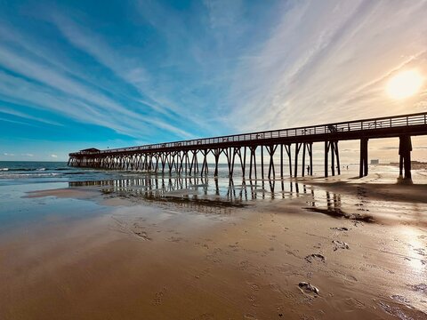 Wooden pier into ocean in the Myrtle Beach State Park,  Horry County, South Carolina. Fishing pier