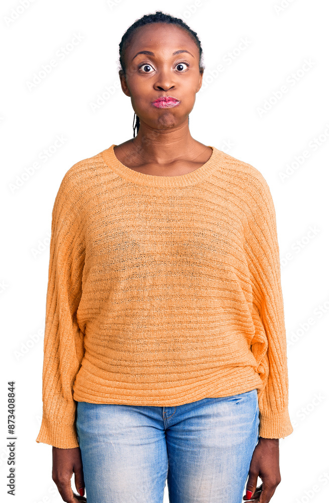 Poster young african american woman wearing casual clothes puffing cheeks with funny face. mouth inflated w