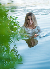 Fototapeta premium Natural appearance lady in the lake. Femininity concept, naturally skin