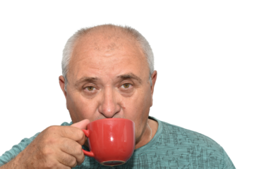 Portrait of an elderly man drinking from a brown cup.