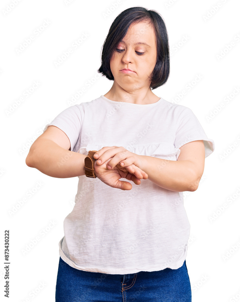 Sticker Brunette woman with down syndrome wearing casual white tshirt checking the time on wrist watch, relaxed and confident