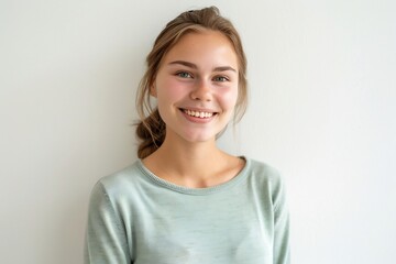 Obraz premium Smiling Young Woman Portrait with White Background