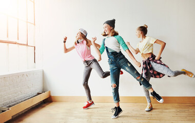 Fototapeta premium Dance, girl group and children with music, studio and rhythm for creative art performance or rehearsal. Smile, culture and happy kids in cool hip hop crew for practice, motion or learning in class