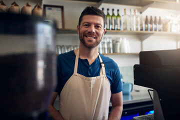 Barista, man or smile on portrait in coffee shop for customer service, hospitality or cafe startup. Small business, waiter or happy server at counter with ready to welcome, bistro management or pride