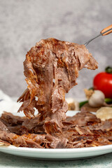 Meat Doner. Traditional Turkish cuisine taste. Cooked meat doner kebab on gray background. local...