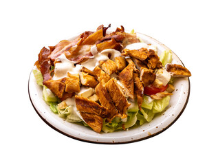 Polish Caesar salad with chicken, bacon and vegetables, high-calorie meat salad with fresh vegetables
