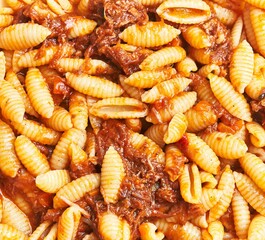 Close-up of delicious pasta with meat sauce, ideal for food-related advertising or menus.
