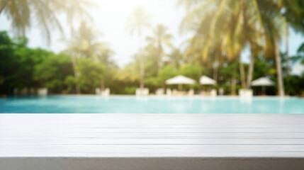 White wooden desk featuring a blurred tropical swimming pool and coconut palm trees as a backdrop for product display