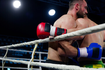 Fierce boxing match showcases athletes' power and skill.