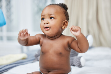 Play, African and newborn baby in clinic for care, growth development and health assessment. Happy...