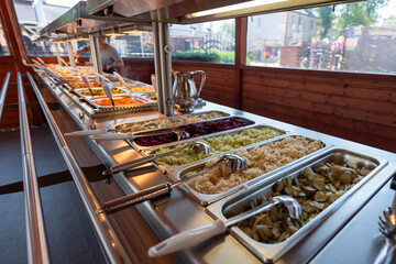 buffet table with a large number of dishes