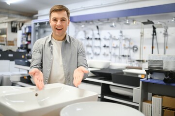 Man at the building market looking for sink into their bathroom