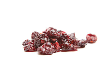 A small heap of dried cranberries isolated on a white background, showcasing their rich red and dark hues with a wrinkled texture, ideal for healthy snacks and culinary uses