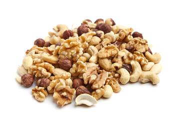 A pile of assorted mixed nuts, including walnuts, cashews, hazelnuts, and almonds, isolated on a white background