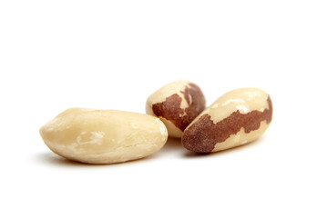Close-up of three Brazil nuts, isolated on a white background. Perfect for food and health-related visuals