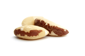 Close-up of three Brazil nuts, isolated on a white background. Ideal for food and nutrition visuals