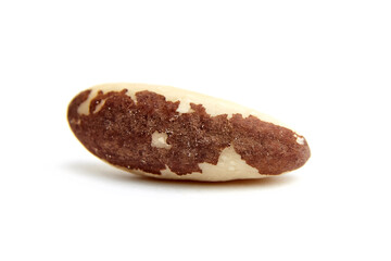 Close-up view of a single Brazil nut with brown skin patches, isolated on a white background. Ideal for showcasing healthy eating, nutrition, and ingredients