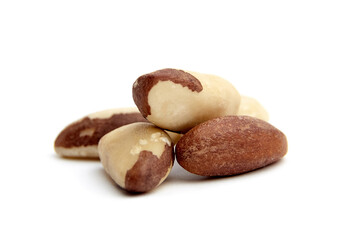 Close-up of several Brazil nuts isolated on a white background. Ideal for illustrating healthy eating, snacks, and nutrition