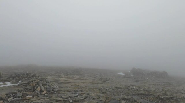 Snowy wind and fog on Maroma peak in thunderstorm day, Sierra Tejeda, Spain 
