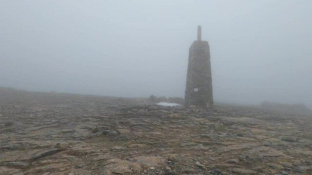 Snowy wind and fog on Maroma peak in thunderstorm day, Sierra Tejeda, Spain 
