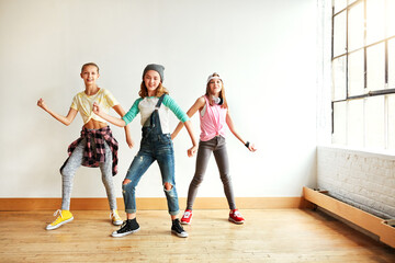 Dancing, girl group and portrait of kids with music, studio and rhythm for creative art performance or rehearsal. Teamwork, class and happy children in cool hip hop crew for practice or learning