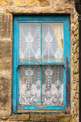 europe, United Kingdom, England, County Durham, Stanley. Beamish.  Old wooden, lace-curtained window.