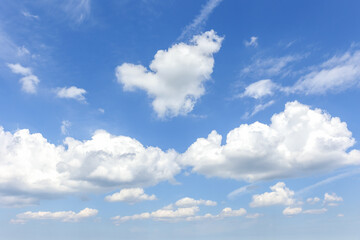 Natural beautiful abstract scenic azure blue sky with white cumulus clouds background on bright sunny summer day. Nature cloudscape tranquil landscape scene backdrop pattern