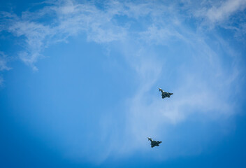 Two RAF typhoons flying, flying in formation back to their respected air fields after taking part...