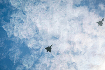 Two RAF typhoons flying, flying in formation back to their respected air fields after taking part...