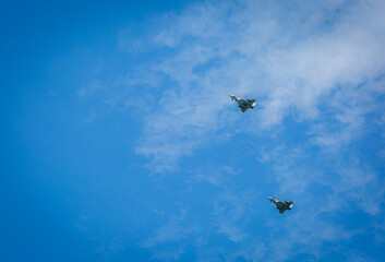Two RAF typhoons flying, flying in formation back to their respected air fields after taking part...