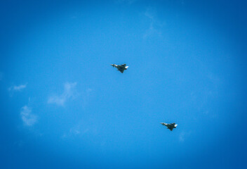 Two RAF typhoons flying, flying in formation back to their respected air fields after taking part...