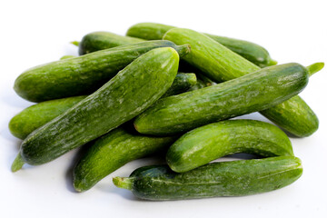 Mini cucumbers on white background.