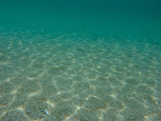 Blue ocean and sandy bottom background