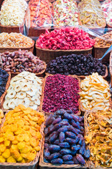 Baskets of dried fruit in a market