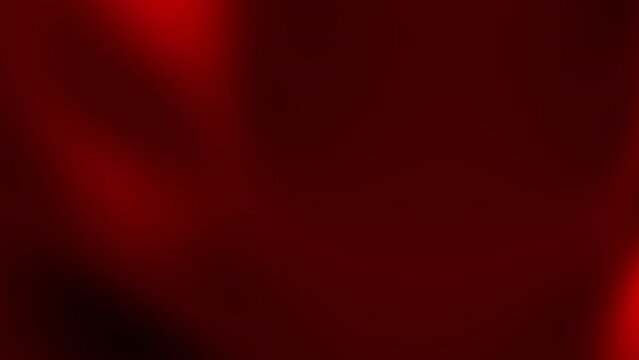 Dark red background blurred, with a light red area. Suitable for Valentine's Day designs, romantic themes, abstract backgrounds, and banners.
