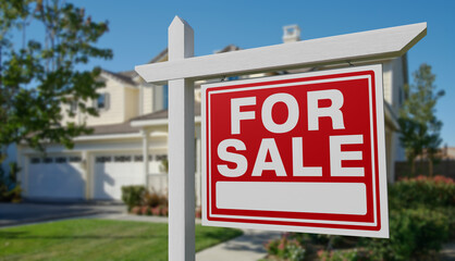 Fototapeta premium For Sale Real Estate Sign in Front of Beautiful House.
