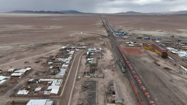 Ollague city and vulcan, El Loa. Border between Bolivia and northern Chile. Aerial view by drone.