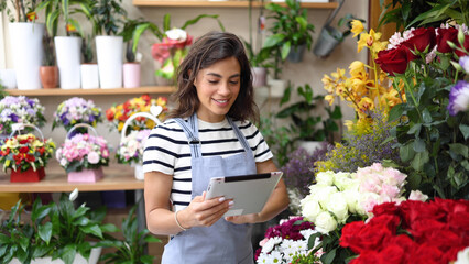 Yung flower shop owner running her business