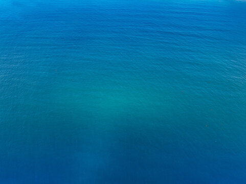 Aerial view of blue sea surface - Powered by Adobe