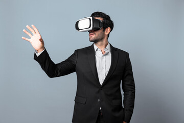 Professional smart business man holding something while wearing VR glasses. Caucasian project...