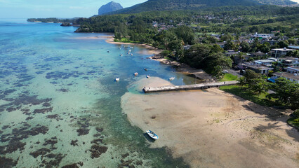 Obraz premium Harbor Pier At Baie Du Cap Beach In Mauritius Island Mauritius. Indian Ocean Beach. Africa Background. Baie Du Cap Beach At Mauritius Island Mauritius. Tourism Landscape. Nature Seascape.